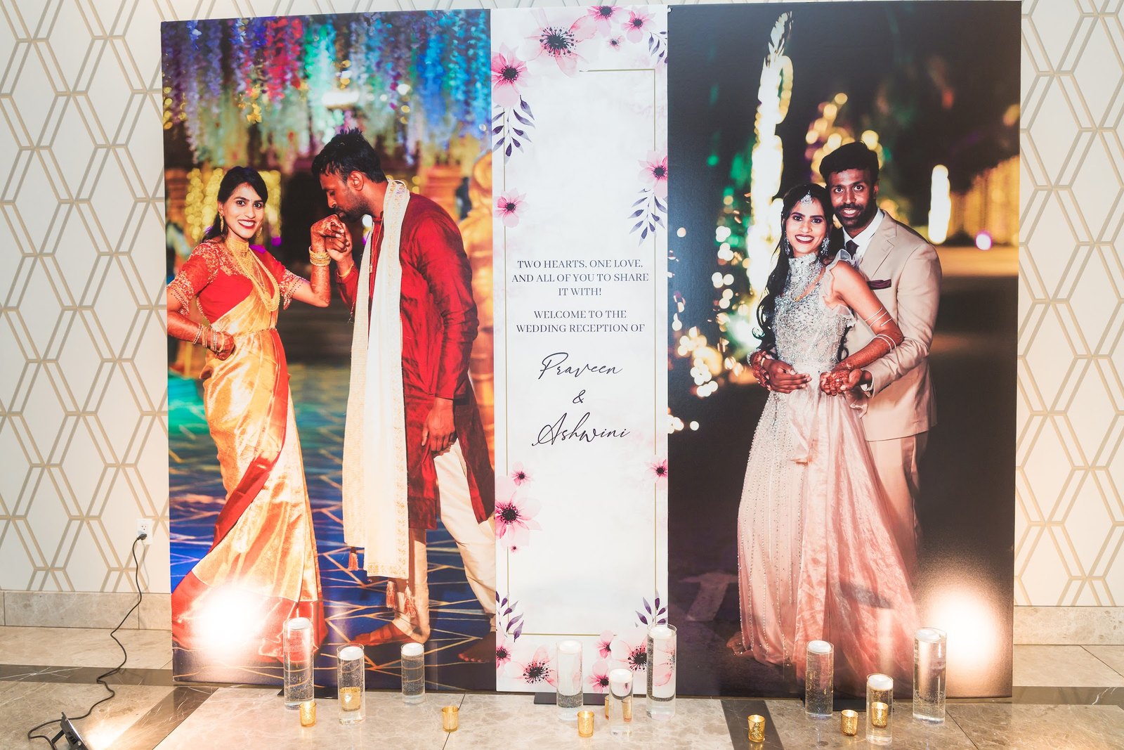 Large couple photo boards with a welcome sign and candles